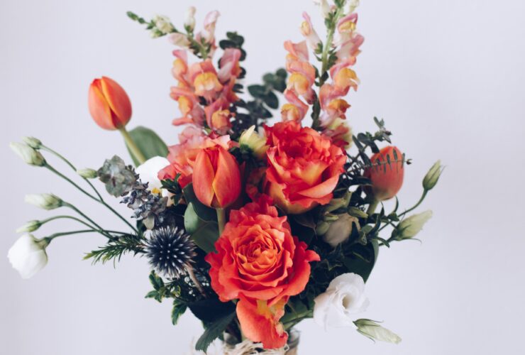 red flower arrangement on white table