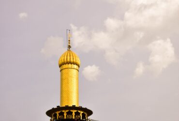 yellow and black concrete minaret tower