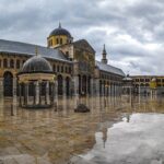 people walking near brown and gray concrete building during daytime