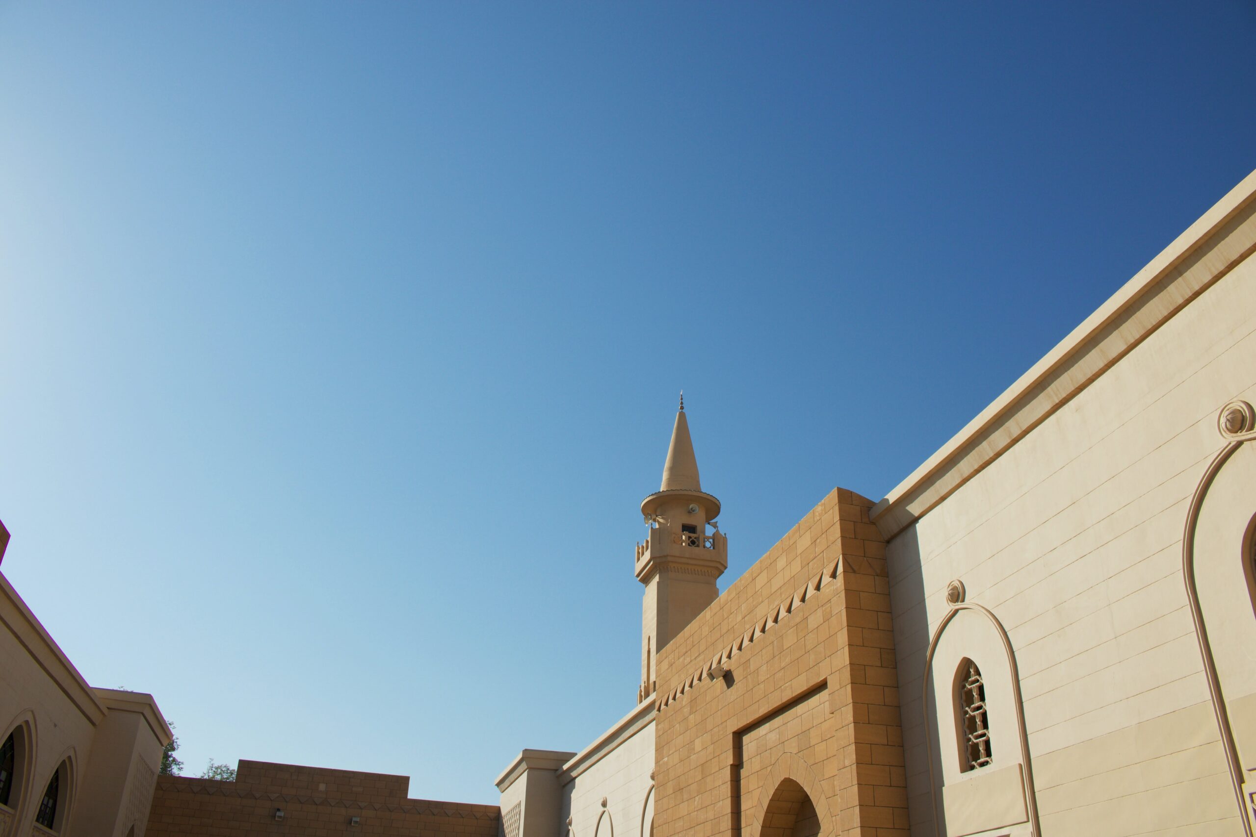 brown concrete building under blue sky during daytime