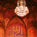 white and gold chandelier on ceiling