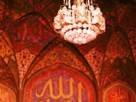 white and gold chandelier on ceiling