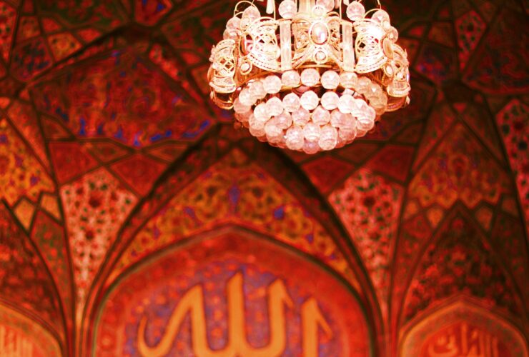 white and gold chandelier on ceiling