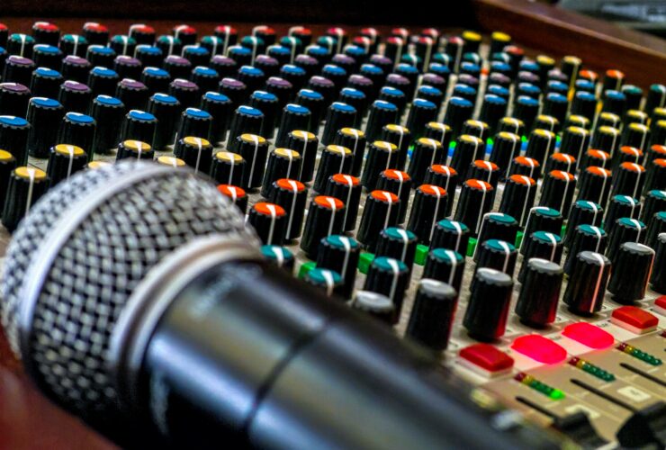 black and silver microphone on audio mixer