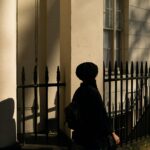 woman walking pass the building
