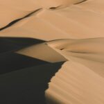 brown sand dunes during daytime