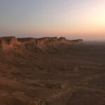 brown rocky mountain under gray sky during daytime