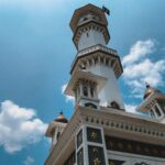 low-angle photography of white and brown tower