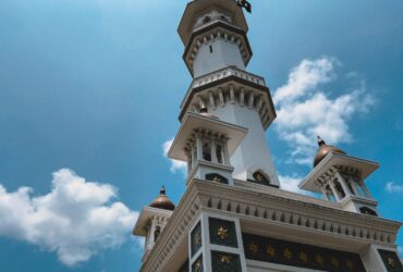 low-angle photography of white and brown tower