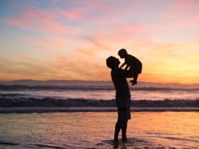 silhouette of man and kid