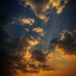 white clouds under blue sky during golden hour