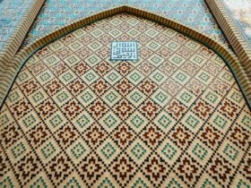 blue white and brown floral textile