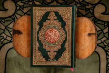 black and red book on brown wooden table