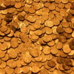 brown round coins on brown wooden surface