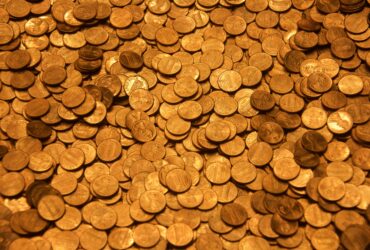 brown round coins on brown wooden surface