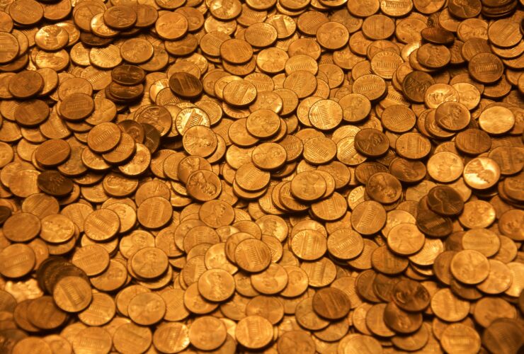 brown round coins on brown wooden surface