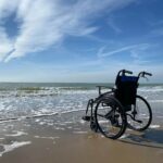 black and gray wheelchair on beach during daytime