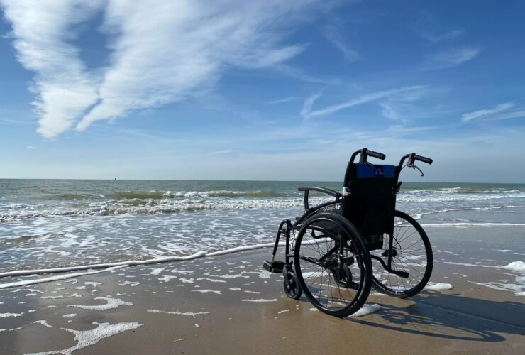 black and gray wheelchair on beach during daytime