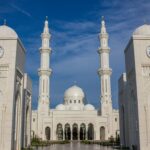 temple with two clock towers during day