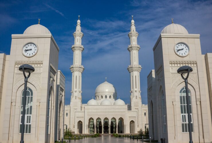 temple with two clock towers during day