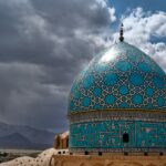 green and white dome building under cloudy sky during daytime