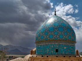 green and white dome building under cloudy sky during daytime