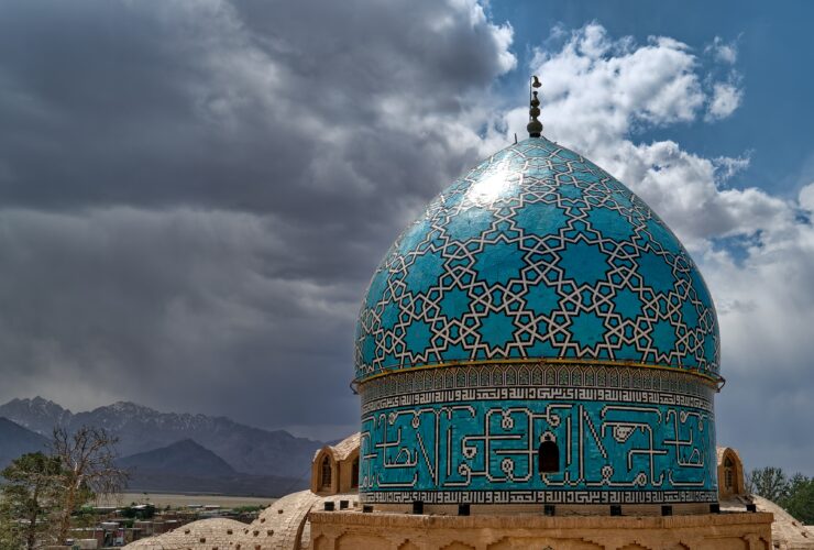 green and white dome building under cloudy sky during daytime