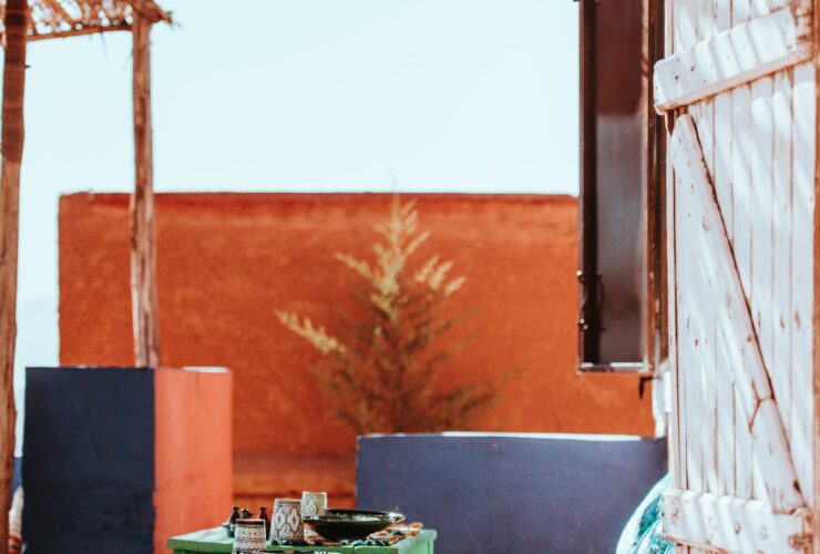 table beside green floral sofa