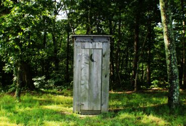 gray wooden outdoor portable bathroom