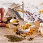person sitting on chair in front of table with food