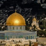 in distant photo of gold and blue temple