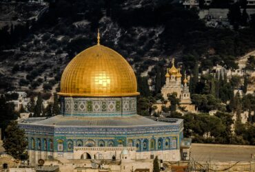 in distant photo of gold and blue temple