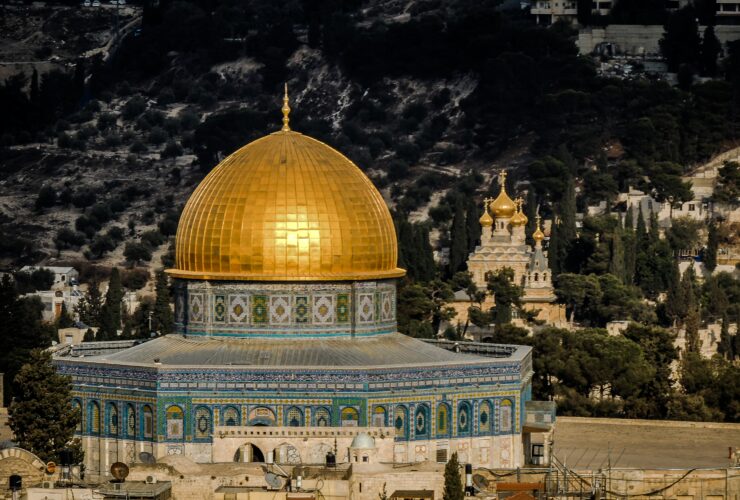 in distant photo of gold and blue temple