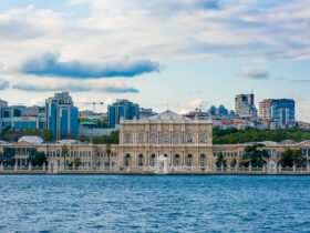 white concrete building near body of water during daytime