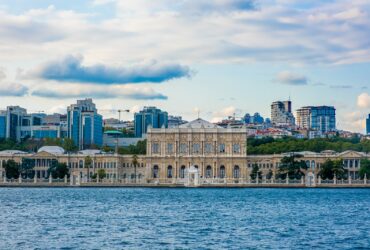 white concrete building near body of water during daytime