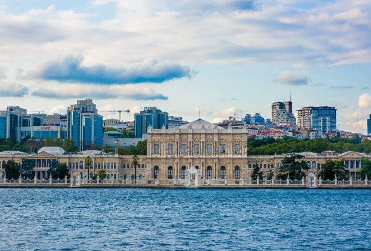 white concrete building near body of water during daytime