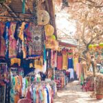 assorted clothes hanged on clothes line during daytime