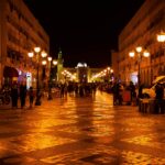 people walking on street during night time