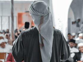 person in white hijab and black long sleeve shirt