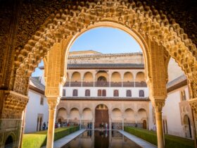 brown and white building under clear blue sky during daytime