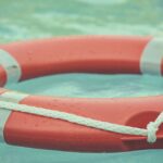 red and white lifebuoy