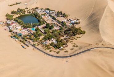 aerial photography of town in the middle of the desert