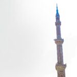 brown and green tower under white sky