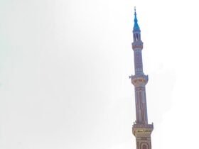 brown and green tower under white sky