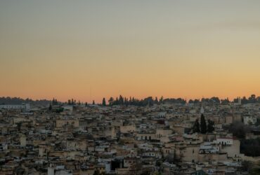 concrete buildings under clouds