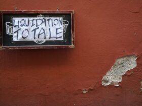 rectangular black and brown liquidation totale signage