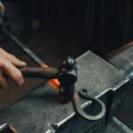 person holding black metal pipe