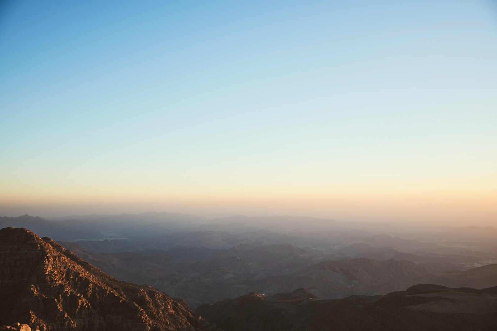 brown mountains under blue sky during daytime