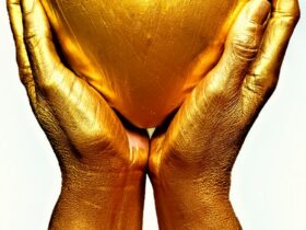 persons hand on white surface