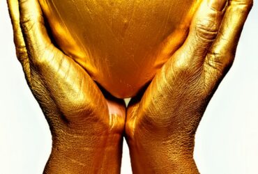 persons hand on white surface